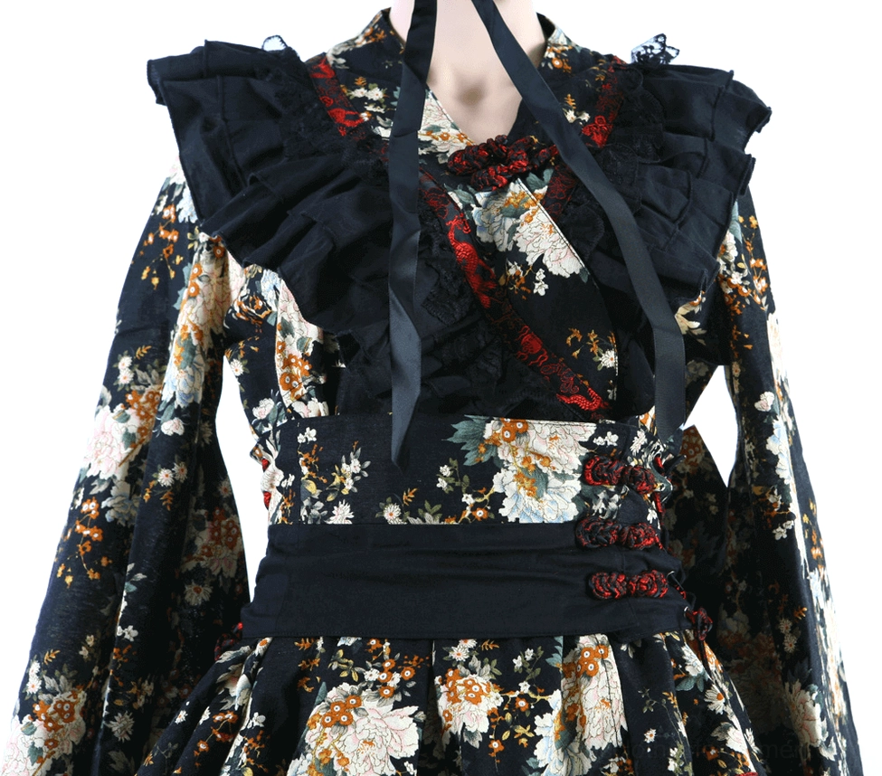 Gothic lolita dress styling perspective showing ruffled layers and matching black leg warmers