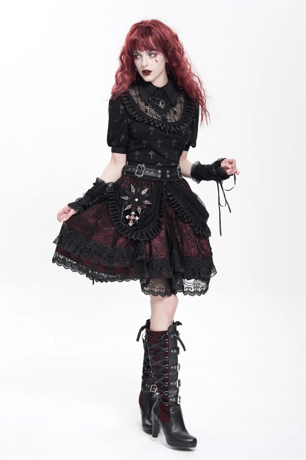 Side angle of gothic lolita costume featuring flared black lace skirt, fingerless gloves, and leather belt with coffin brooch accent piece