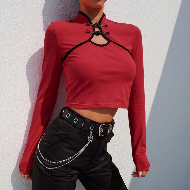 Red burgundy gothic crop top styled with punk chain belt - side view showing sleeves and cropped length silhouette