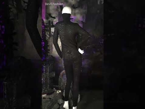 Black gothic long sleeve top with face-covering turtleneck, full-body styling shot on dark background
