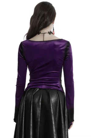 Gothic velvet top back view showing fitted long sleeves and asymmetric ruffled hem detail on model