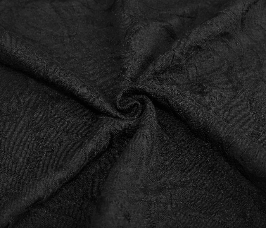 Black gothic long sleeve top showing jacquard weave texture, asymmetrical design, and alternative aesthetic