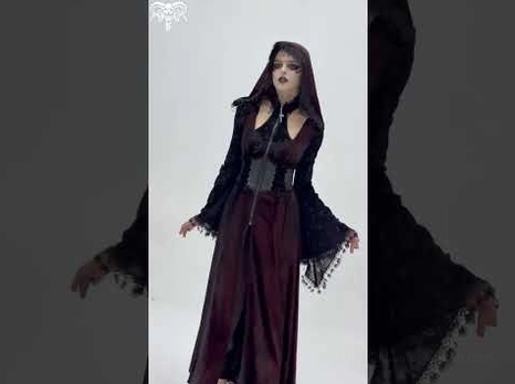 Alternative fashion gothic hooded maxi coat burgundy velvet with black lace sleeves, rear full-length display mannequin view