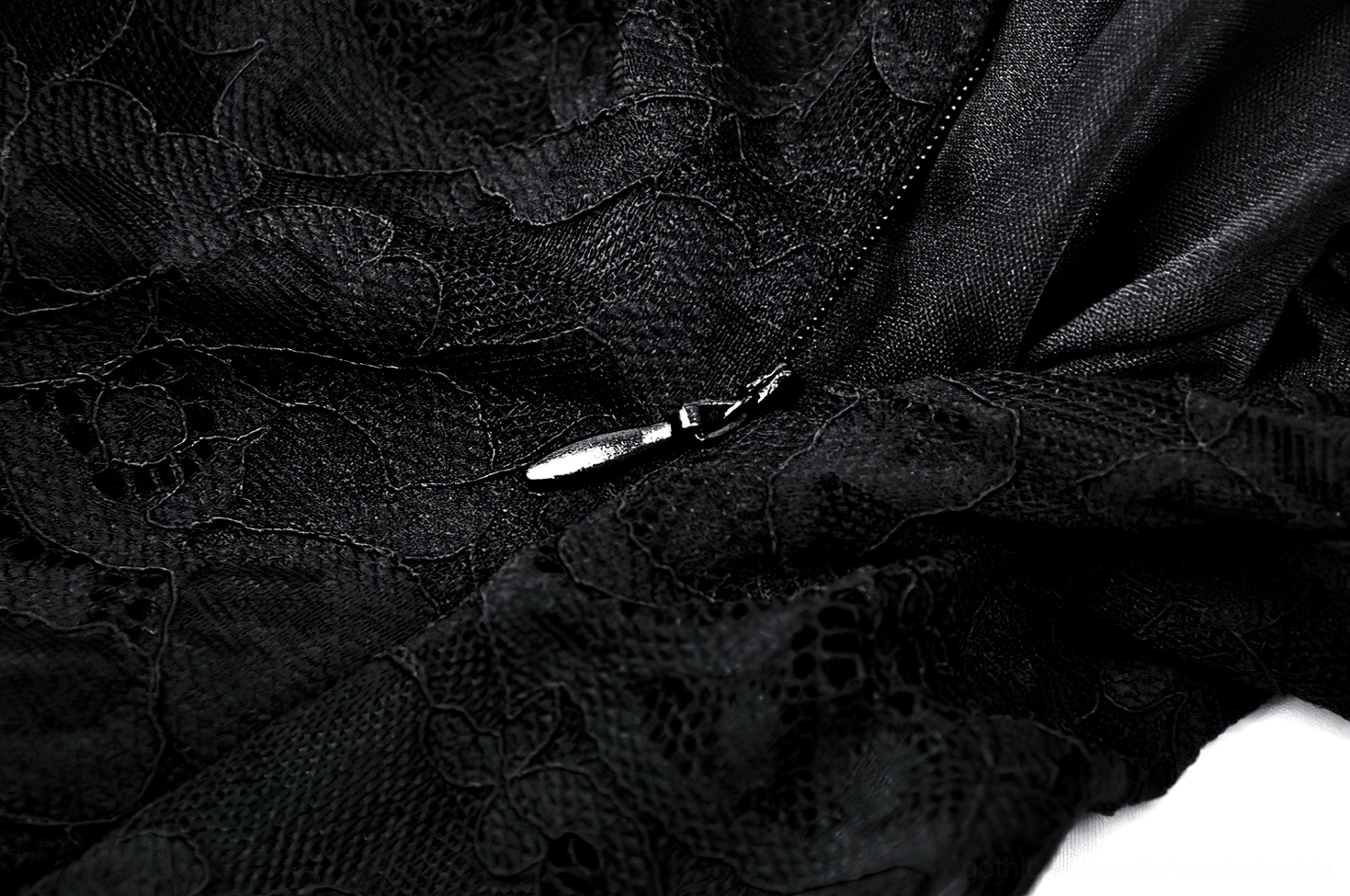 Black lace gothic maxi dress hem detail showing floor-length silhouette and ruffled edge