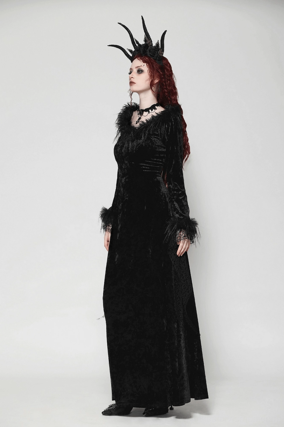 Black velvet gothic maxi dress detail view of lace tassel sleeves and feathered cuff embellishments
