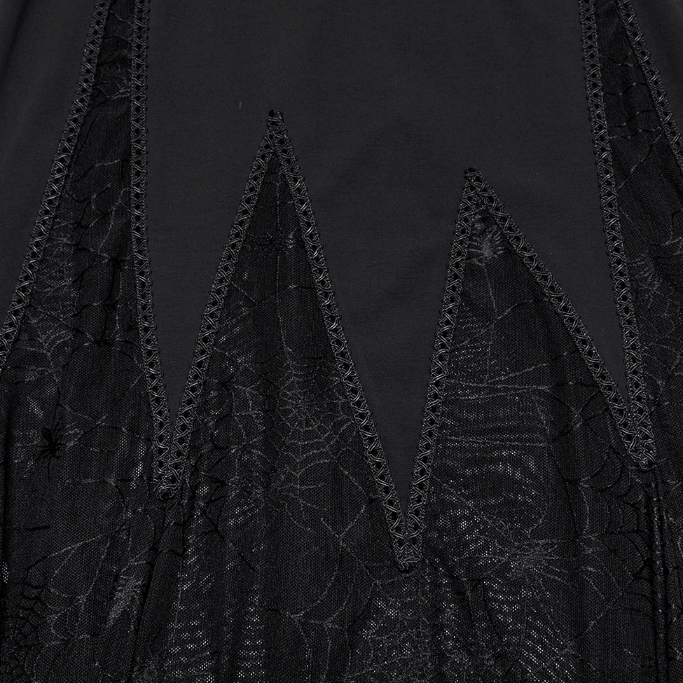 Close-up view of black gothic dress jagged scalloped hem with sheer spiderweb mesh fabric construction