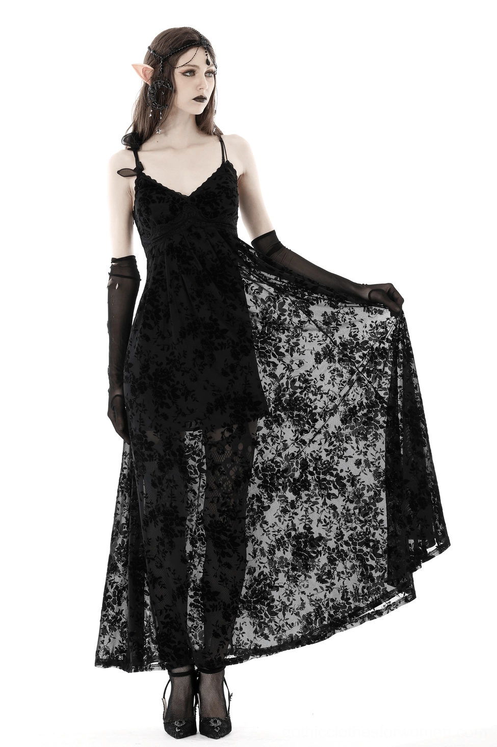 Close-up of black gothic maxi dress side panel showing lace-up trim and velvet rose burnout texture