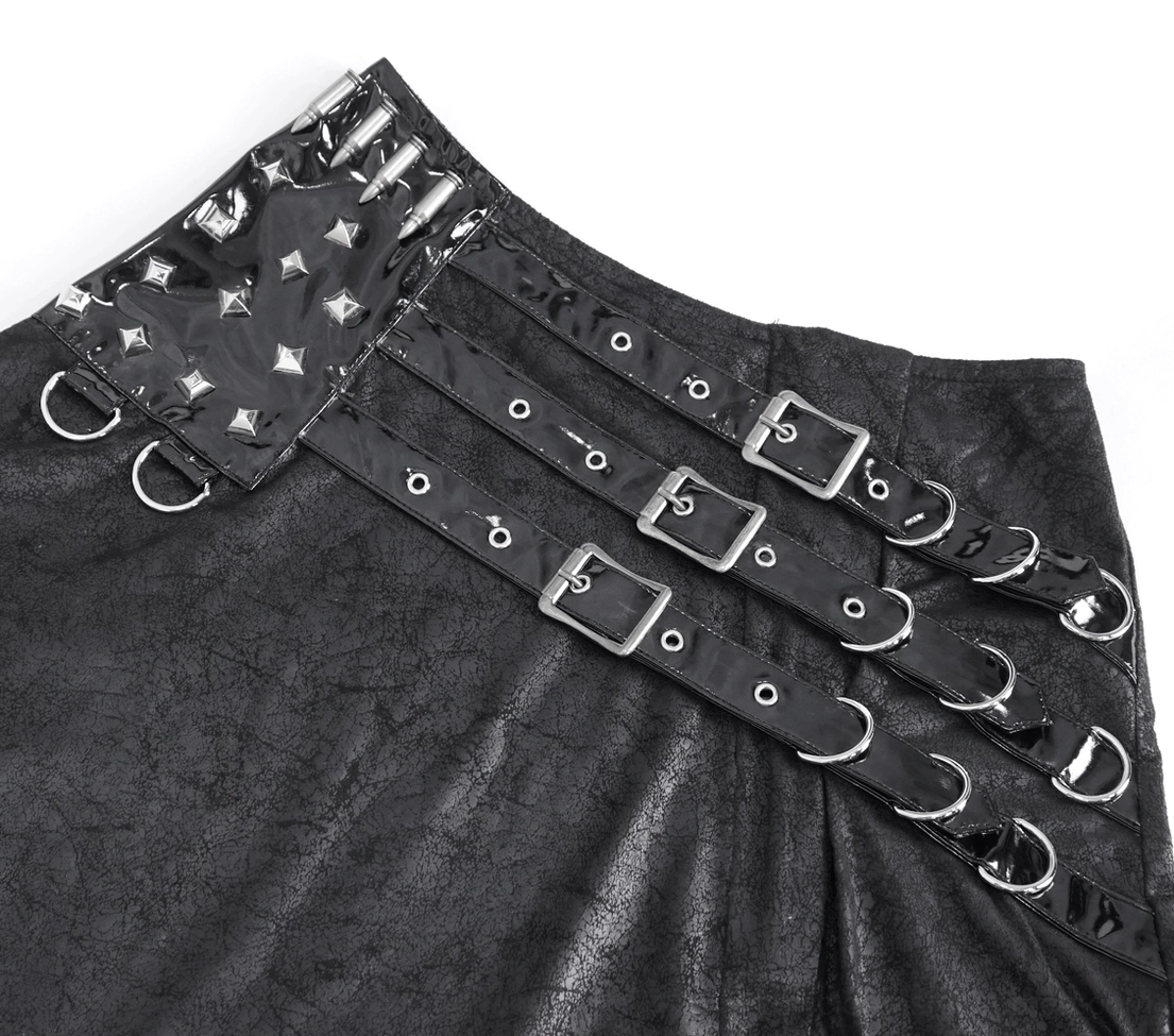 Close-up side view of adjustable black leather skirt buckle strap showing functional metal eyelets and matte faux leather finish with precision craftsmanship