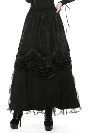 Black crushed velvet gothic maxi skirt front view with ruched drape and lace hem detail
