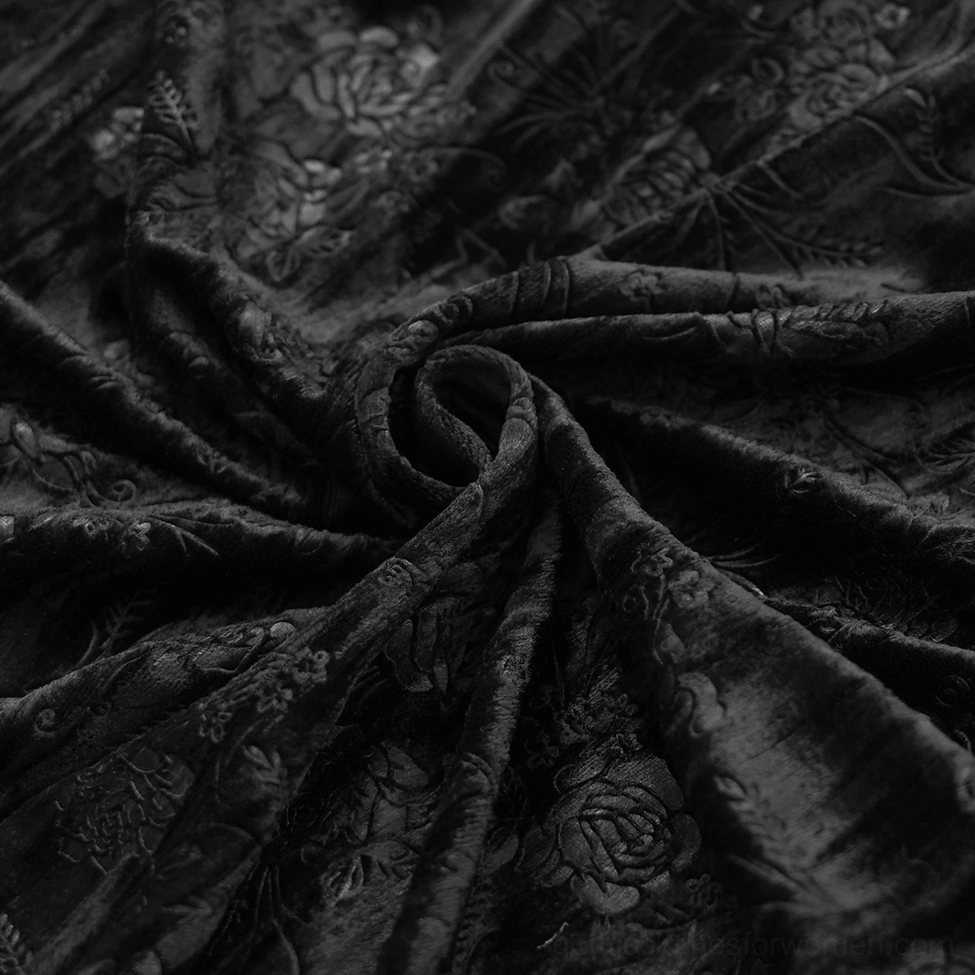 Black gothic lace maxi skirt with intricate embroidered details and tassel decoration close-up view