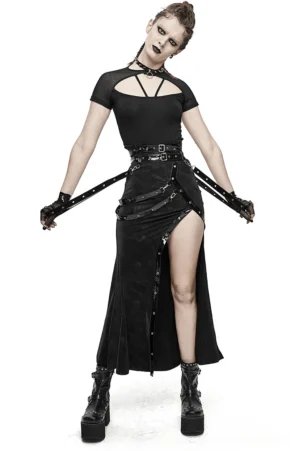Full-length model wearing black gothic steampunk maxi skirt with harness straps paired with matching gothic top and platform boots