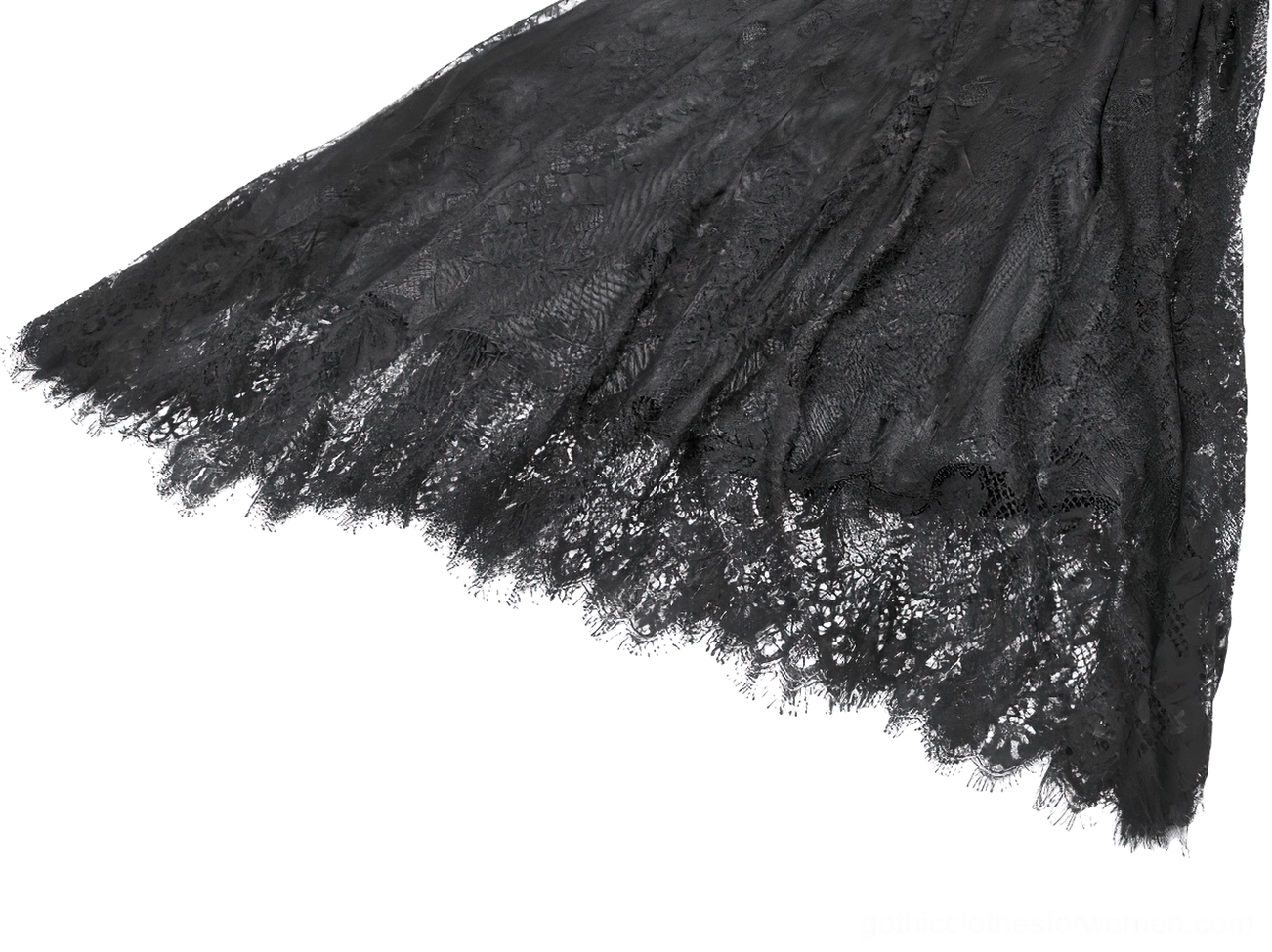Close-up detail shot of gothic maxi skirt hem showing sheer lace fabric with frayed scalloped edge and tassel trim