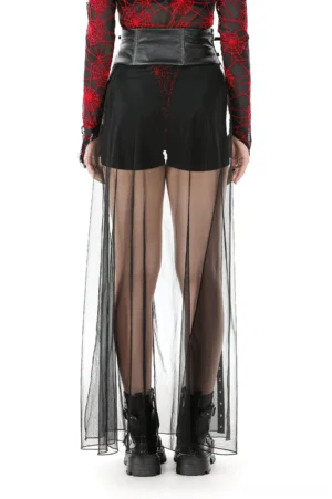 Rear view of studded gothic maxi skirt with high-waisted faux leather panel, metal grommet trim, and transparent mesh fabric flowing to floor
