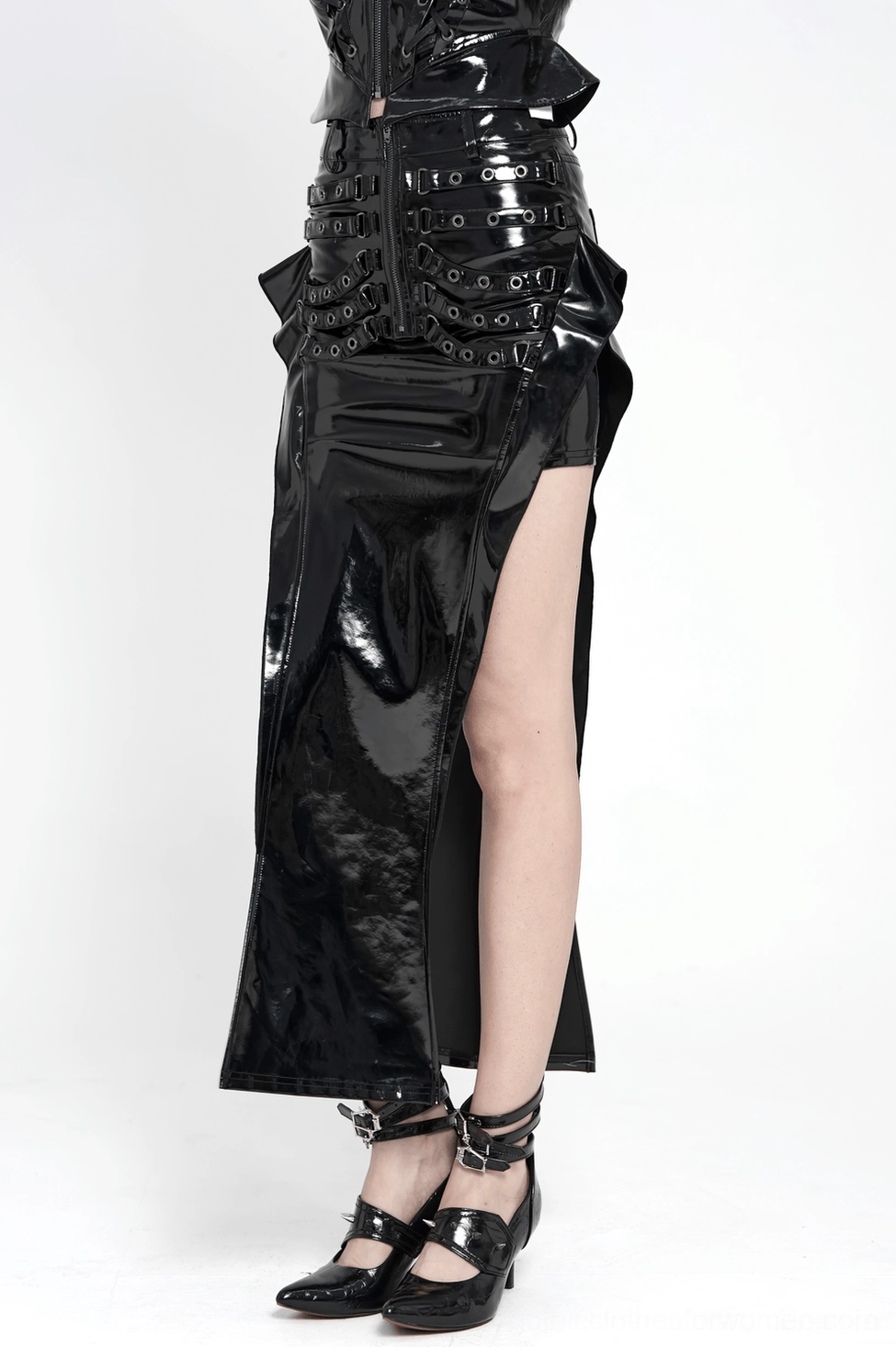 Side profile detail of black patent gothic maxi skirt showing thigh slit opening and sculptural hip panel construction
