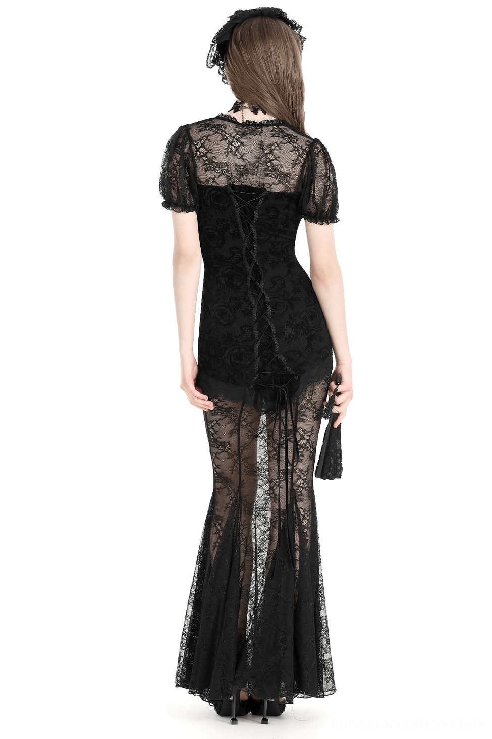 Black gothic mermaid gown featuring lace-up back closure, sheer floral fishtail skirt, and matching gothic hair fascinator, back view