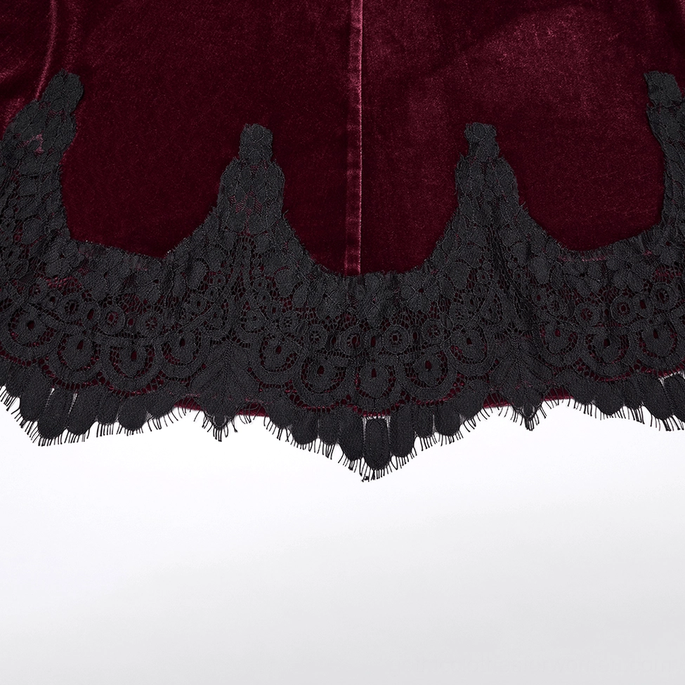 Extreme close-up of black scalloped lace hem trim on burgundy velvet gothic mermaid skirt showing frayed edge detail and texture