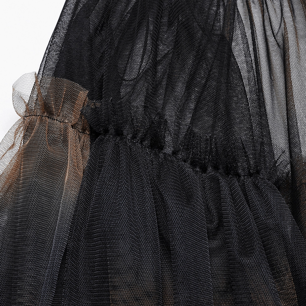 Sheer black and brown gradient mesh tulle fabric detail, ruffled hem trim showcasing transparent layering and ombre color transition
