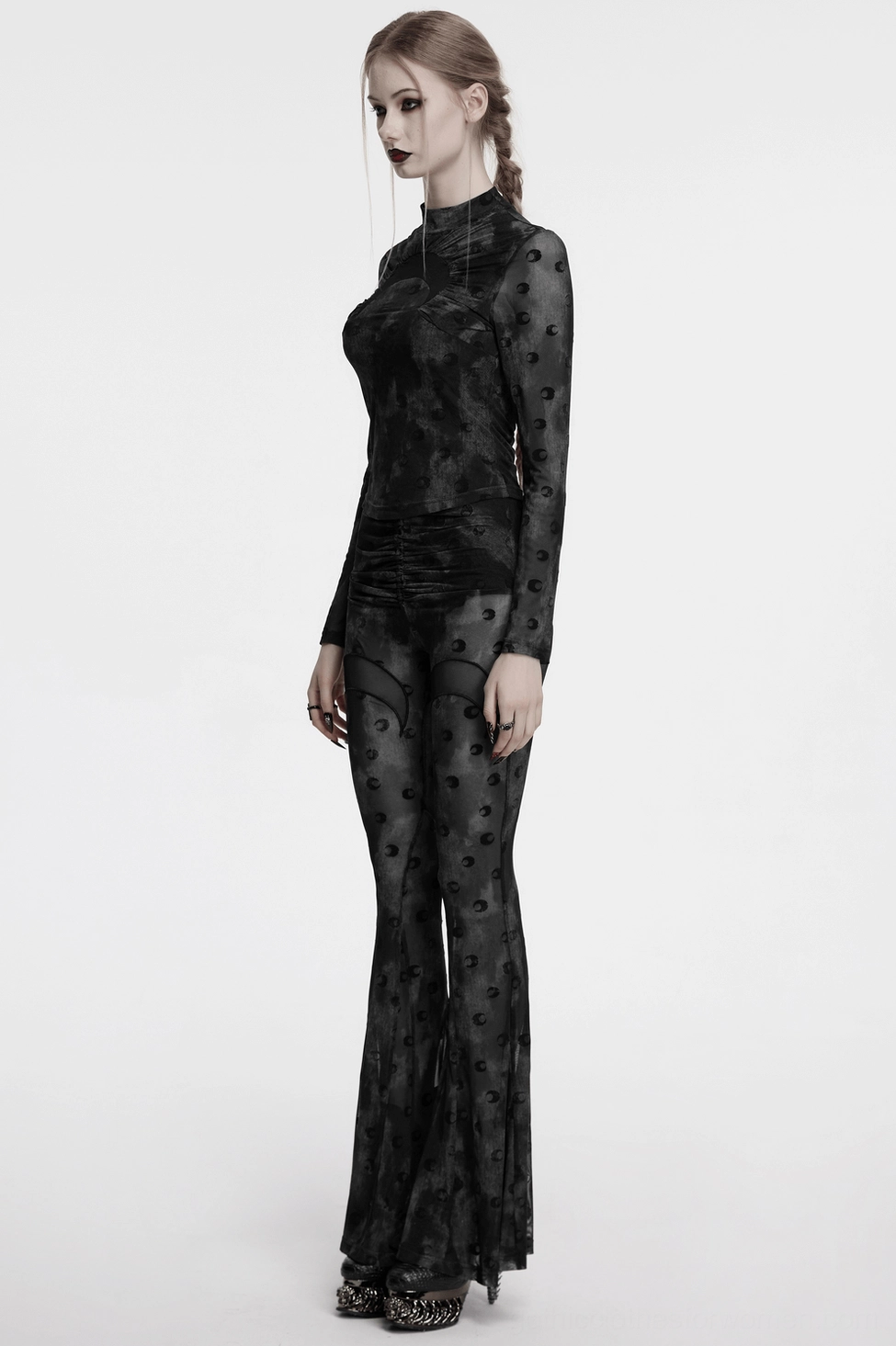 Model wearing lunar crescent mesh flare pants styled with alternative fashion accessories - full length outfit view