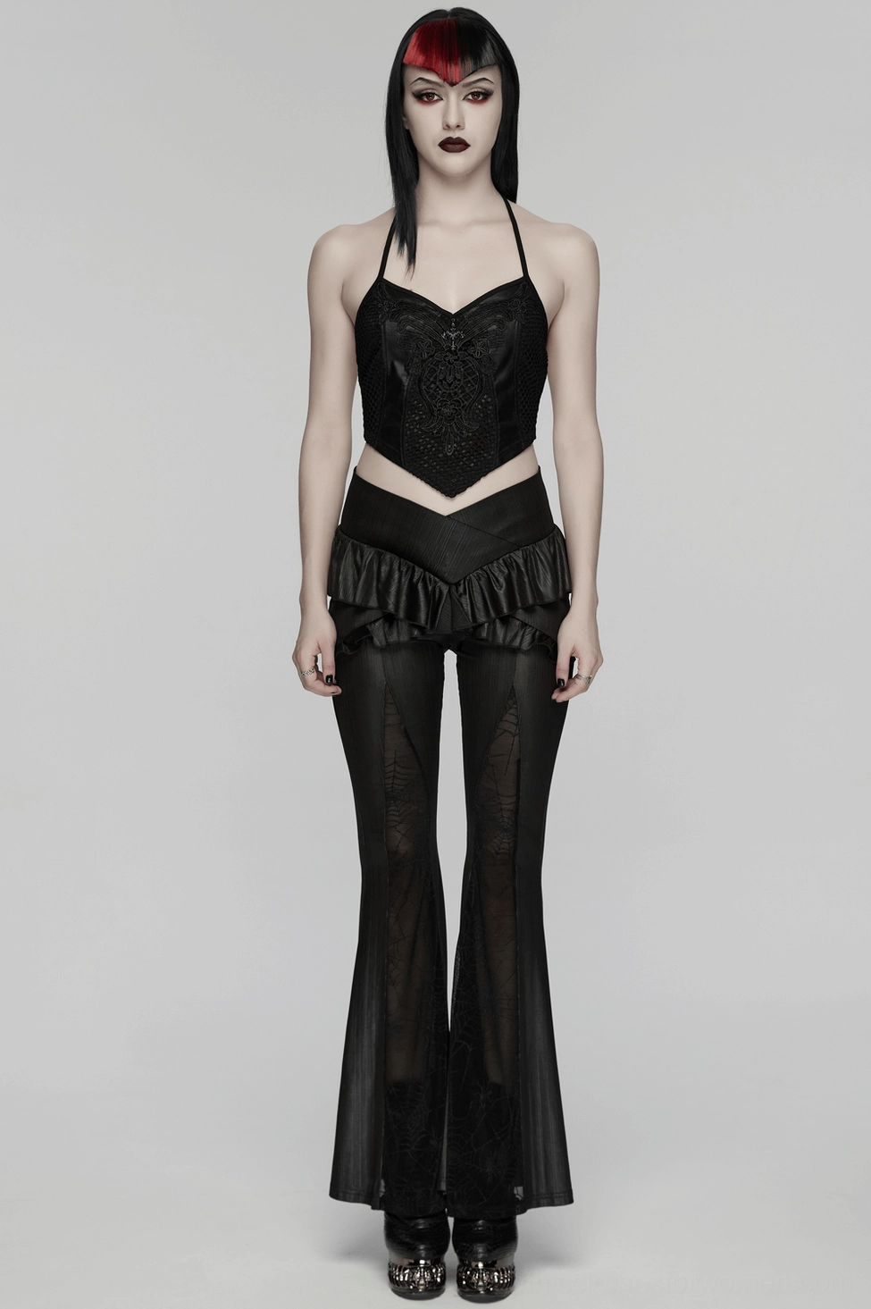 Gothic spider web mesh flared pants showing detailed mesh panel inserts and cross ruffle waist construction from front angle