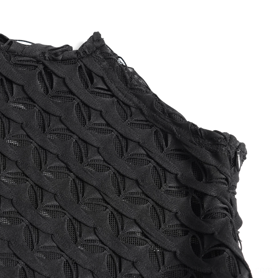 Extreme close-up detail of black geometric woven hollow mesh fabric sheer base weave gothic lace top