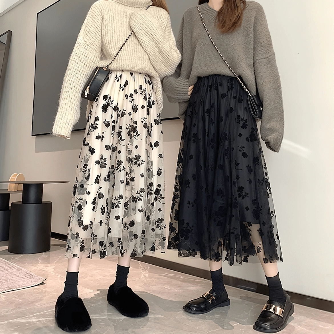 Gothic floral and black mesh midi skirts styled on models, indoor living room, casual dark aesthetic wear