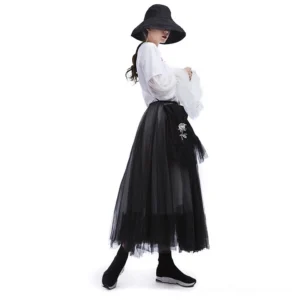Gothic mesh midi skirt full side view with wide-brim black hat and styled outfit, layered texture detail