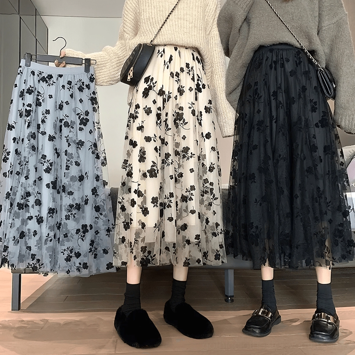 Two models wearing gothic floral mesh midi skirts, full body styling, knit tops, tulle silhouette showcase