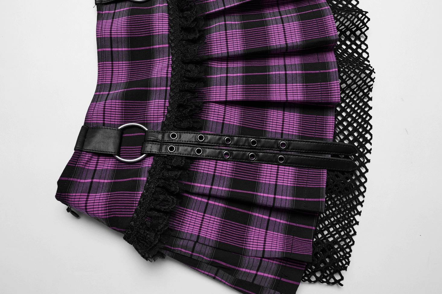 Purple gothic mesh mini skirt detail showing invisible side zipper, plaid fabric weave, and mesh overlay texture