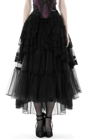 Women's black mesh gothic maxi skirt with cascading ruffles worn by model, front full-body view with purple corset, black stockings and platform heels