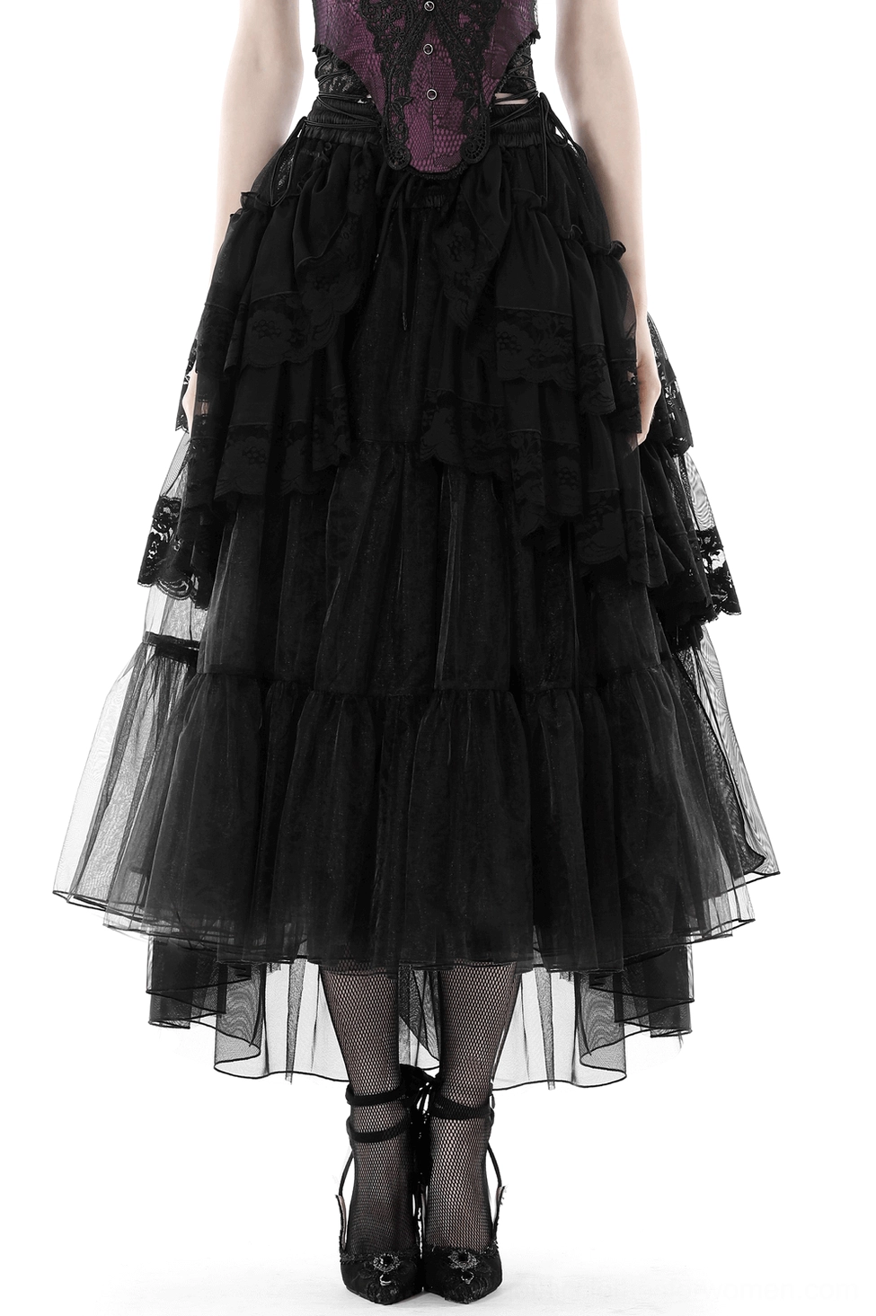 Women's black mesh gothic maxi skirt with cascading ruffles worn by model, front full-body view with purple corset, black stockings and platform heels