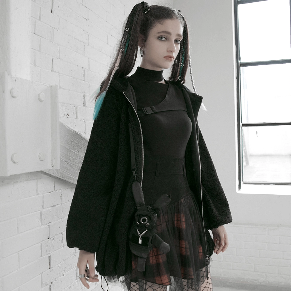 Detailed product view of black and orange plaid gothic mesh skirt highlighting premium fabric quality and construction elements