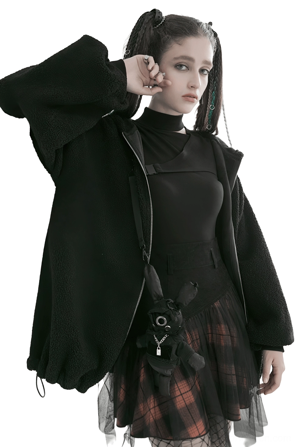 Side profile view of black and orange plaid gothic mesh skirt showing layered tulle hem and voluminous silhouette with model carrying fuzzy crossbody bag