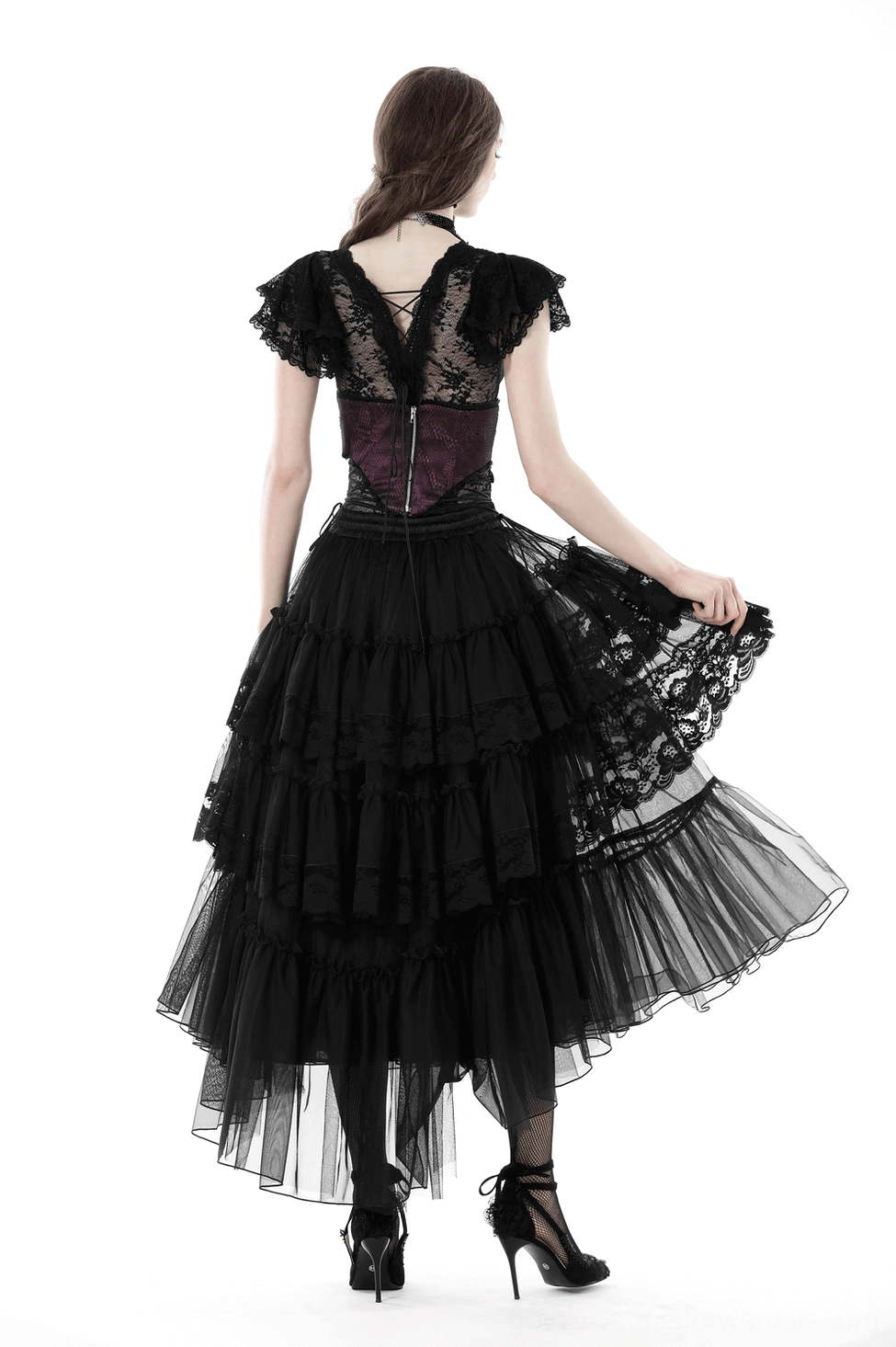 Detailed side view of black gothic skirt showing volume and drape of cascading tulle ruffles