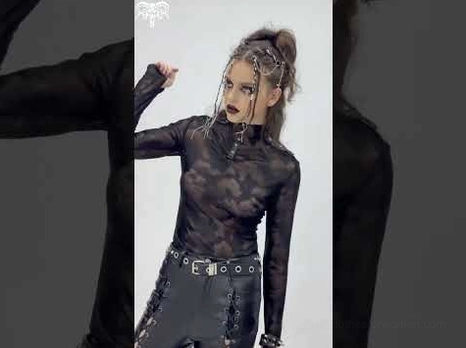 Side view of gothic studded high-neck mesh top on model