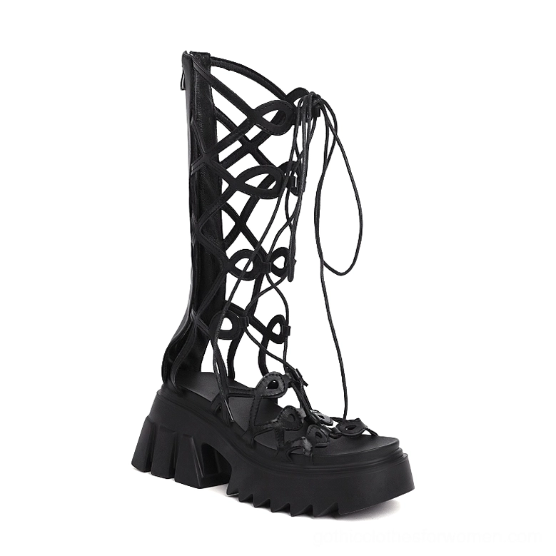 Black microfiber platform sandals side profile showing chunky lug sole and crisscross straps