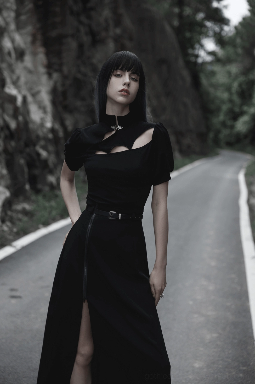 Black gothic midi skirt showcasing A-line silhouette and flowing chiffon movement with detachable leather belt in alternative fashion style