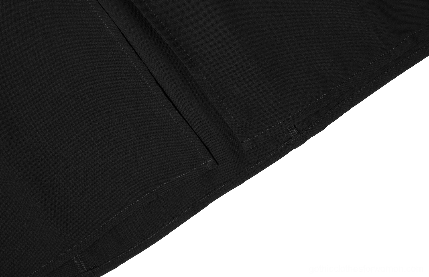 Close-up detail of black gothic midi skirt fabric weave and tailored seams showing matte polyester chiffon material and precise stitching