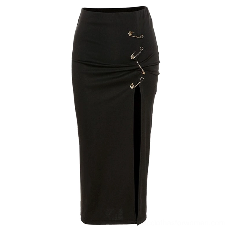 Black gothic midi skirt displayed on mannequin showing high waist and dramatic side slit with metal safety pin embellishments