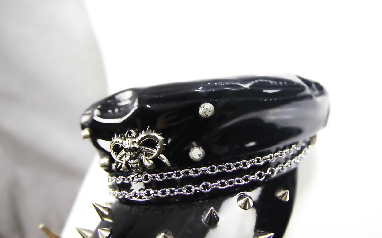 Skull bow ornament and metal spikes on black gothic military cap crown - front top view