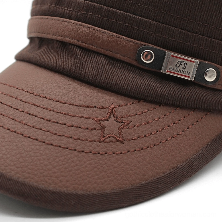 Gothic military flat-top cap adjustable leather strap and metal closure hardware detail