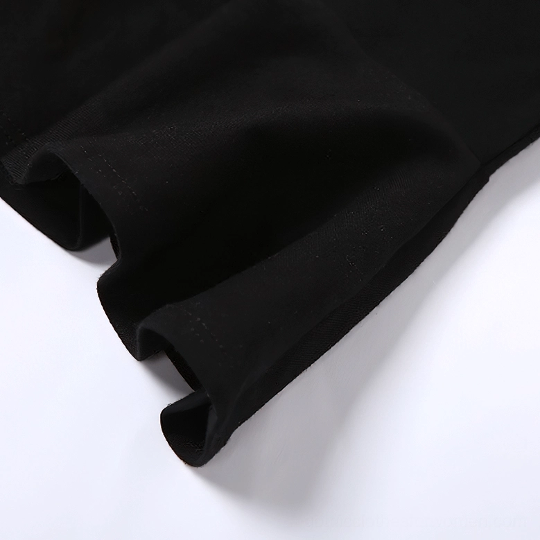 Black gothic dress fabric and hem edge close-up, displaying soft stretch polyester-spandex blend and finish