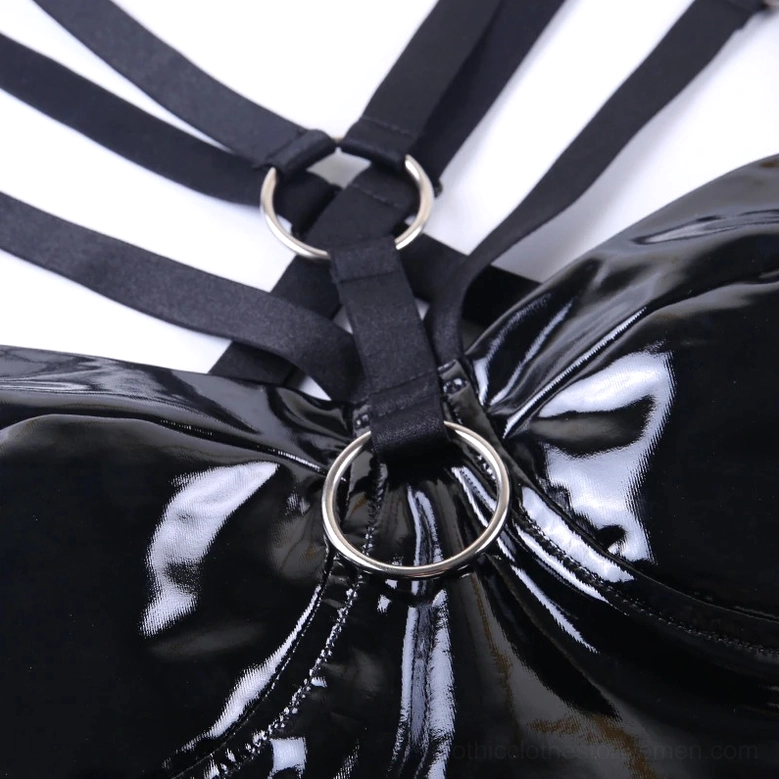 Top close-up of gothic bodycon dress showing central O-ring and knotted elastic crisscross straps