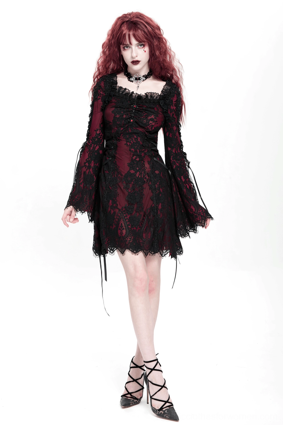 Side view of gothic lace mini dress showing dress silhouette fit and drape of wine red base with black lace overlay