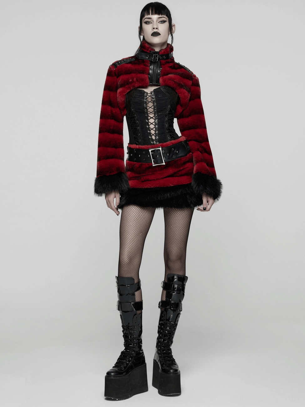 Back view of red faux fur gothic skirt showing studded waistband, waist structure, and black fuzzy hem