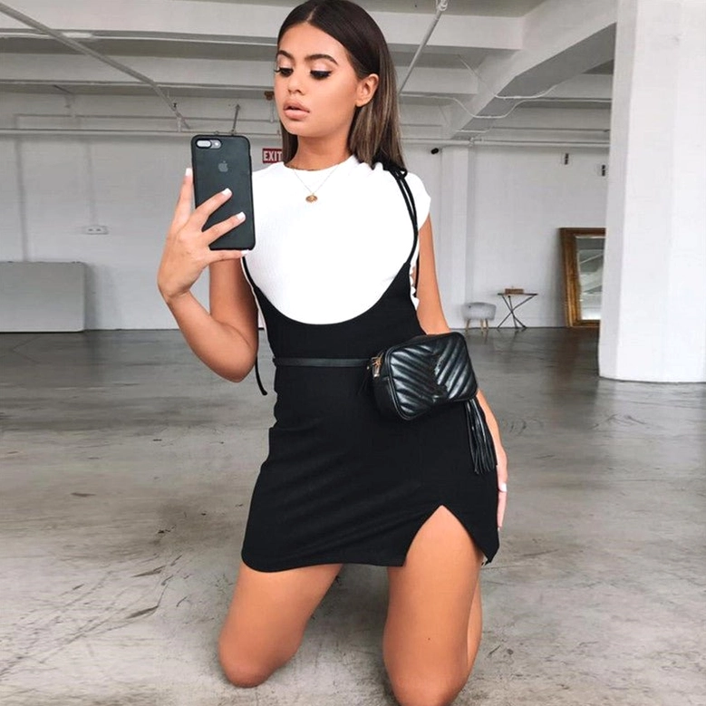 Black gothic mini skirt styled with crossbody bag club ready look