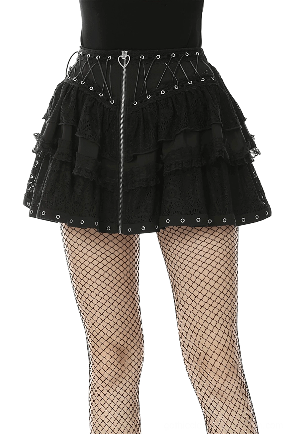 Black heart-laced gothic mini skirt with front zipper and metal grommets, front view on model with fishnet tights