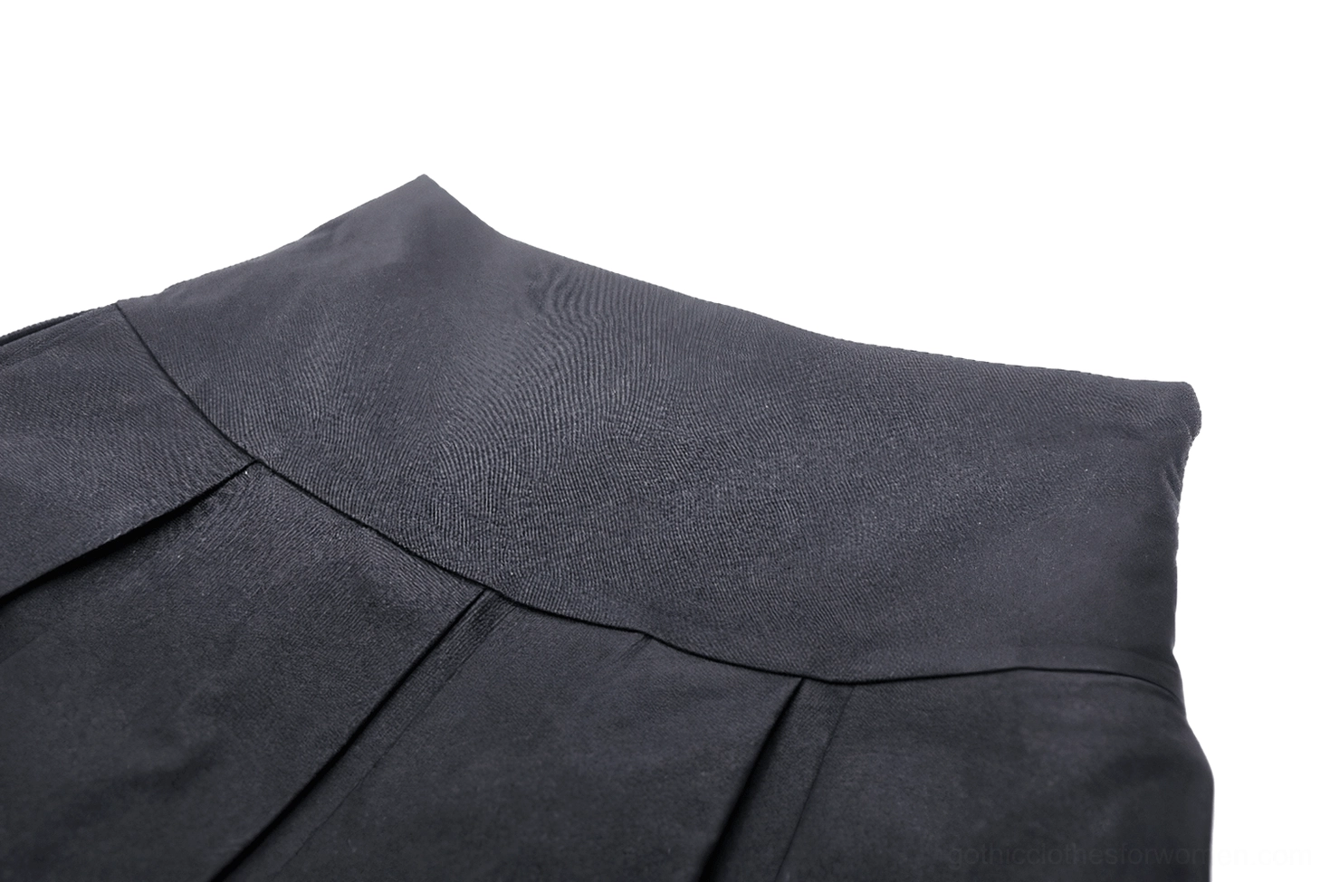 Close-up detail of black gothic mini skirt waistband showing high-waisted design, hidden zipper, and twill fabric weave