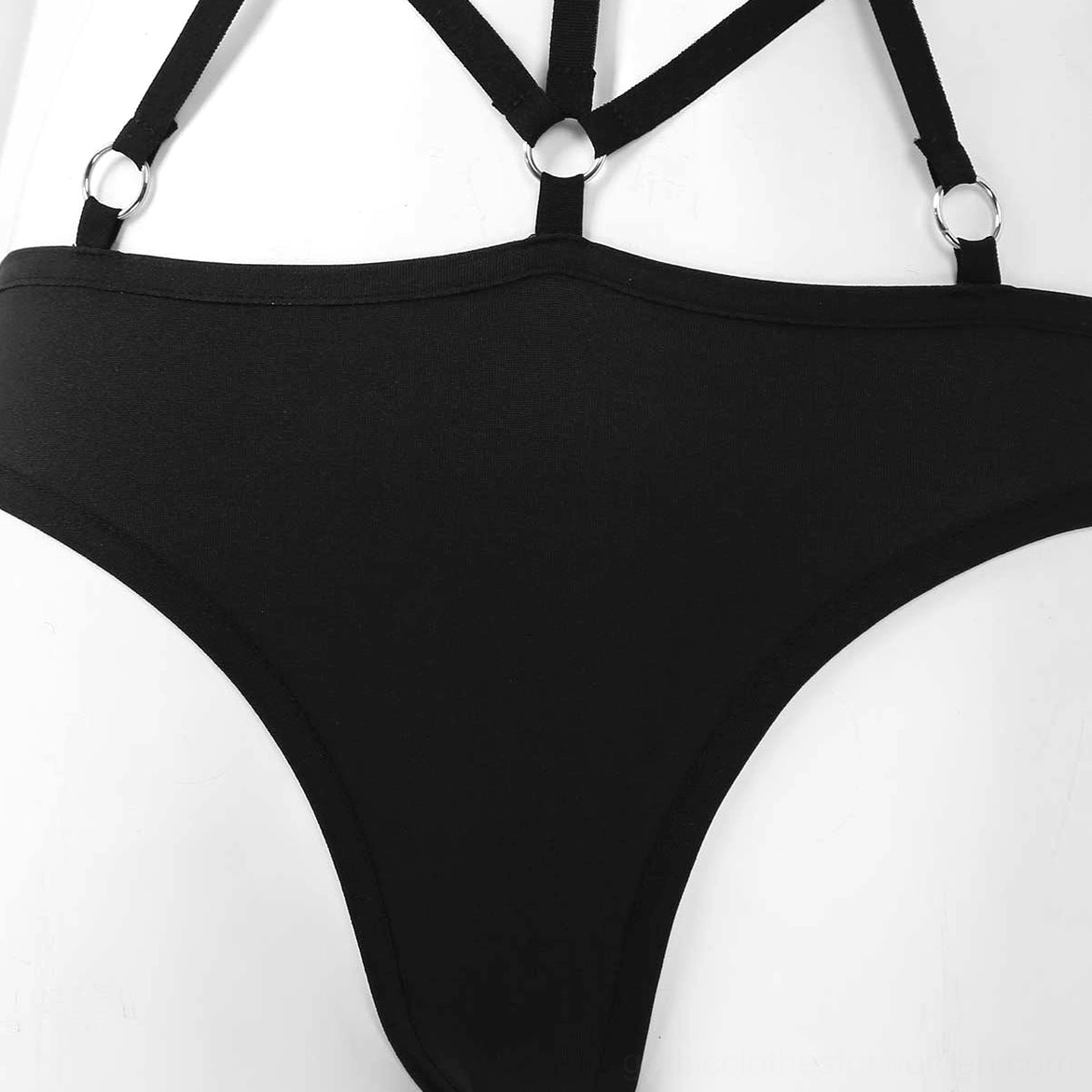 Black gothic monokini alternative angle view showing structural design and metal ring accents across straps