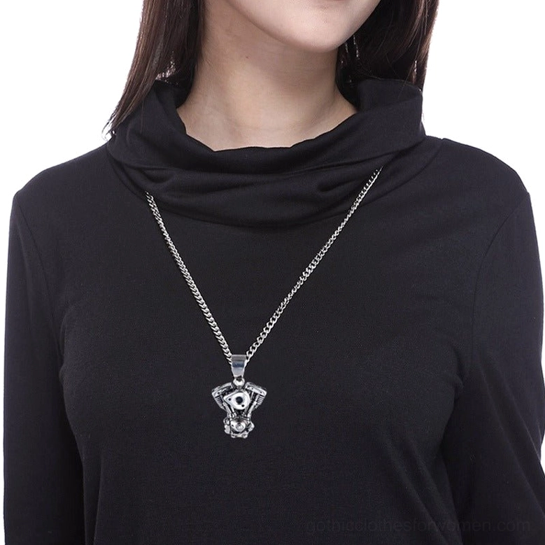 Woman wearing gothic motorcycle engine pendant necklace on body, demonstrating how vintage biker pendant sits on chest