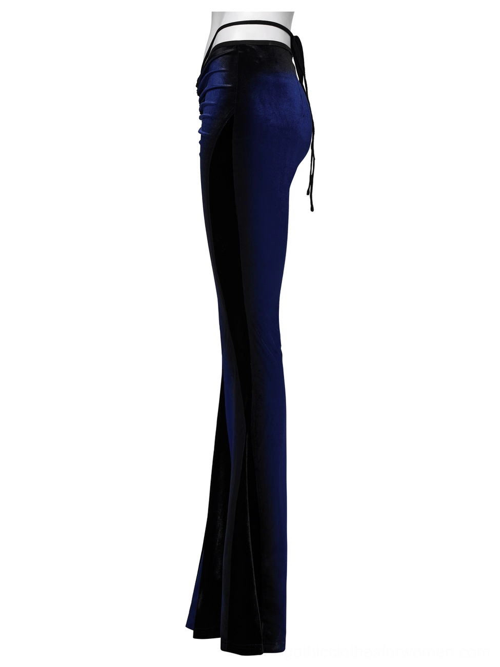 Side profile of gothic navy velvet pants showing slim fit through hips and dramatic flared leg silhouette